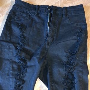 Black ripped Bermuda shorts